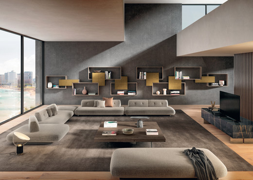 beige sofa with freestanding backrests and wall-mounted bookcase | Sand Sofa | LAGO