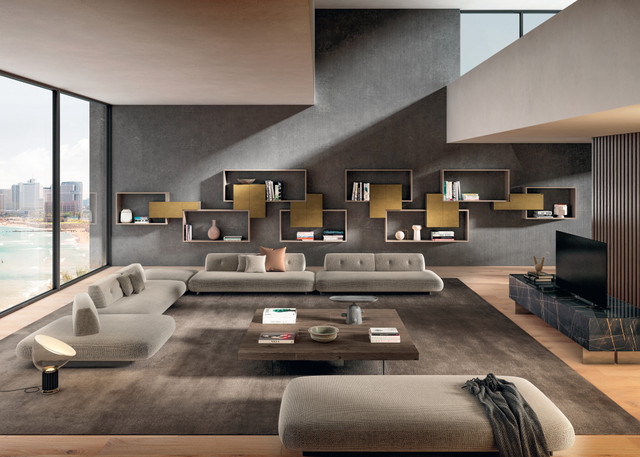 beige sofa with freestanding backrests and wall-mounted bookcase | Sand Sofa | LAGO