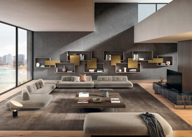 beige sofa with freestanding backrests and wall-mounted bookcase | Sand Sofa | LAGO